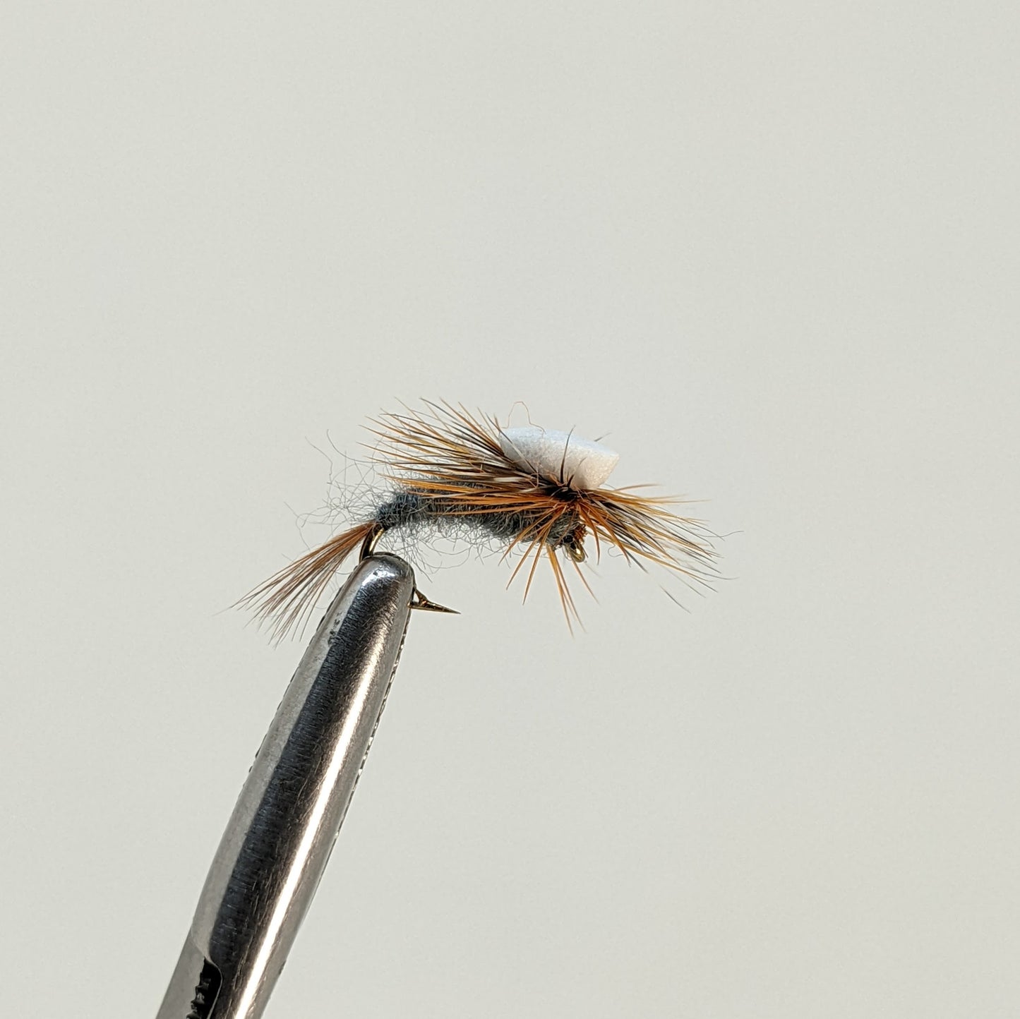 Adams Emerger  Fly fishing fly. Dry, subsurface and nymph flies for anglers and fisherman. All the flies you need for sale online. Flies to buy online. Online fly fishing supplies. Catch fish with flies from Frontier Flies.