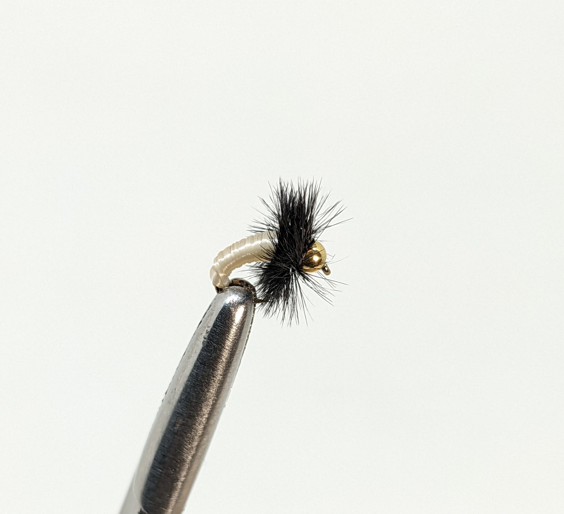 Caddis Larva Bead Head Creme  Fly fishing fly. Dry, subsurface and nymph flies for anglers and fisherman. All the flies you need for sale online. Flies to buy online. Online fly fishing supplies. Catch fish with flies from Frontier Flies.