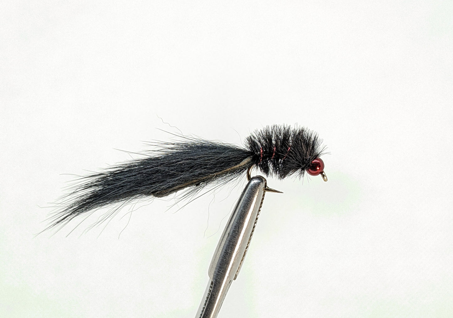 Micro Leech Bead Head Black   Fly fishing fly. Dry, subsurface and nymph flies for anglers and fisherman. All the flies you need for sale online. Flies to buy online. Online fly fishing supplies. Catch fish with flies from Frontier Flies.