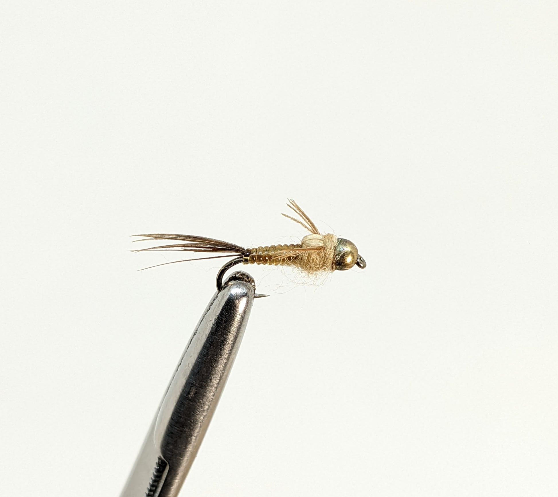 Nymphomaniac Bead Head Tan  Fly fishing fly. Dry, subsurface and nymph flies for anglers and fisherman. All the flies you need for sale online. Flies to buy online. Online fly fishing supplies. Catch fish with flies from Frontier Flies.