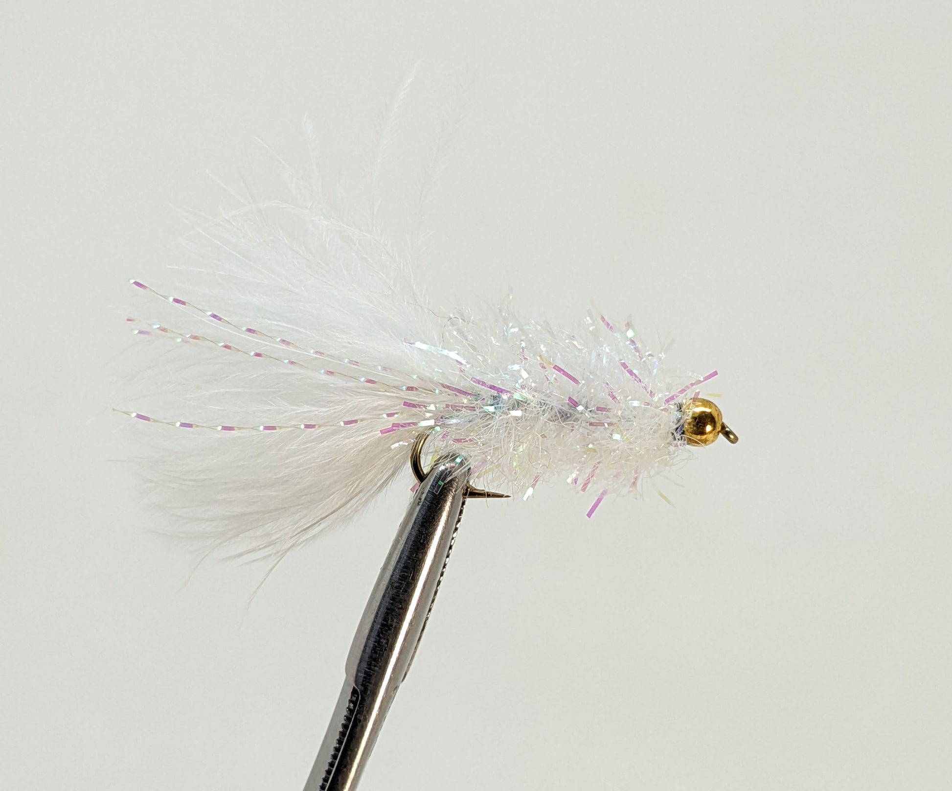 Woolly Bugger White Fly fishing fly. Dry, subsurface and nymph flies for anglers and fisherman. All the flies you need for sale online. Flies to buy online. Online fly fishing supplies. Catch fish with flies from Frontier Flies.